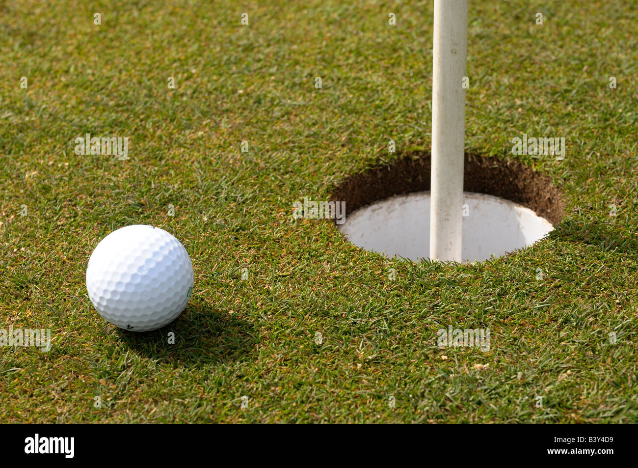 Et le trou de balle de golf Banque D'Images