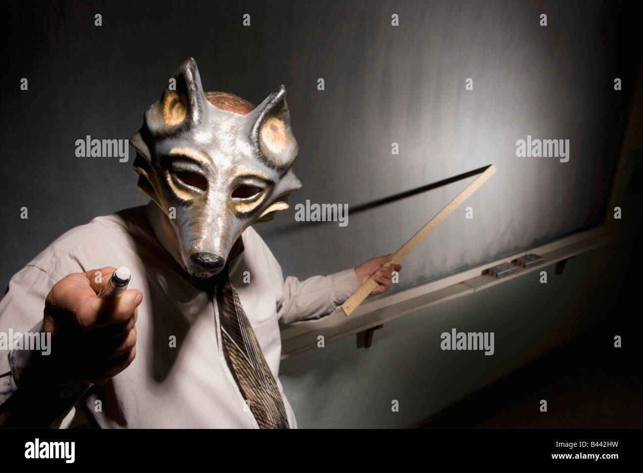Le port d'un masque animal enseignant Banque D'Images
