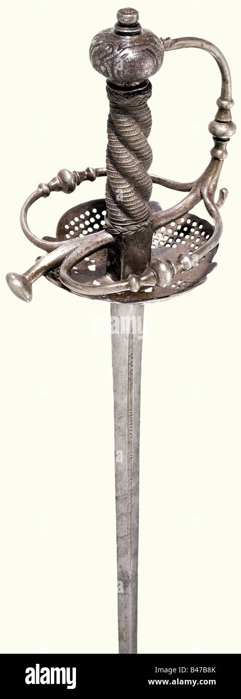 Une petite épée, en France, vers 1650 UNE lame striée avec des rainures des deux côtés. Dans les rainures l'inscription 'Pedro en Toledo'. Plaque de protection en fer à travail ouvert, bucklebow hilt, pommeau comprimé légèrement ciselé. Poignée tournée avec bobinage de fil fin et ferrules tressés. Longueur 103 cm. Historique, historique, XVIIe siècle, épée, épées, armes, armes, arme, bras, dispositif de combat, militaire, militaria, objet, objets, alambiques, coupures, découpe, découpe, découpe, arme de mêlée, armes de mêlée, métal, Banque D'Images