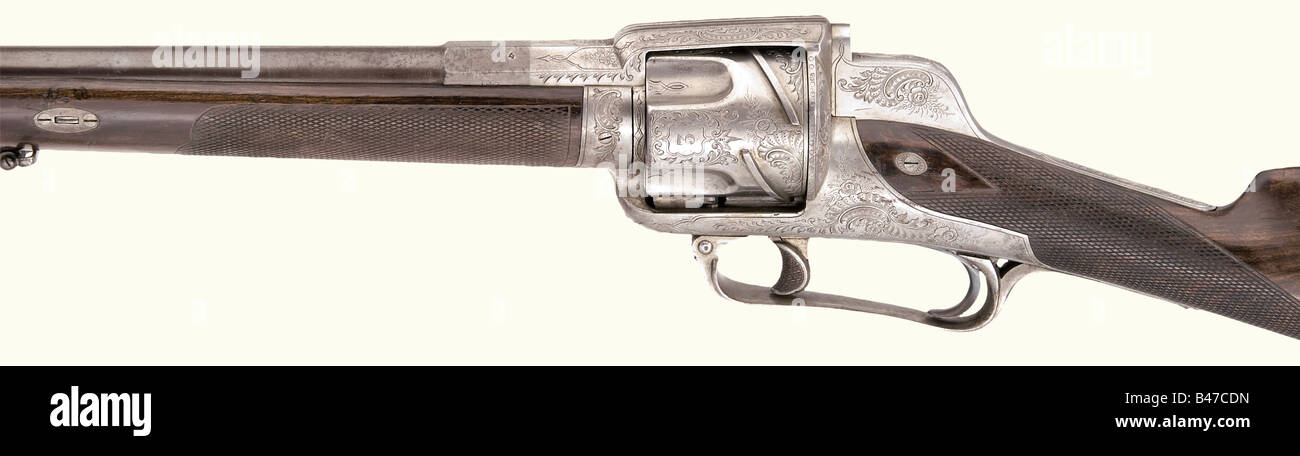 Un fusil tournant, fabricant inconnu, vers 1865. Corps octogonal fusionnant à rond, fût bleué avec alésage lisse en calibre 15 mm. Sur la racine du fourreau marquée '4' ainsi que sur le côté d'une marque inconnue. Le châssis porte des gravures Rocaille, cylindre à 4 coups pour les cartouches coniques en laiton(?). Les chambres sont numérotées de 1 à 4. Sur la porte de chargement droite et l'extracteur. Déclenchement avec levier répétitif. Demi-bouillon de noyer avec damier. Support en fer gravé. Longueur 113,5 cm. Fusil tournant rare de haute qualité en excellent état. Erwerbsscheinpflichtig. Historique, historique, Banque D'Images