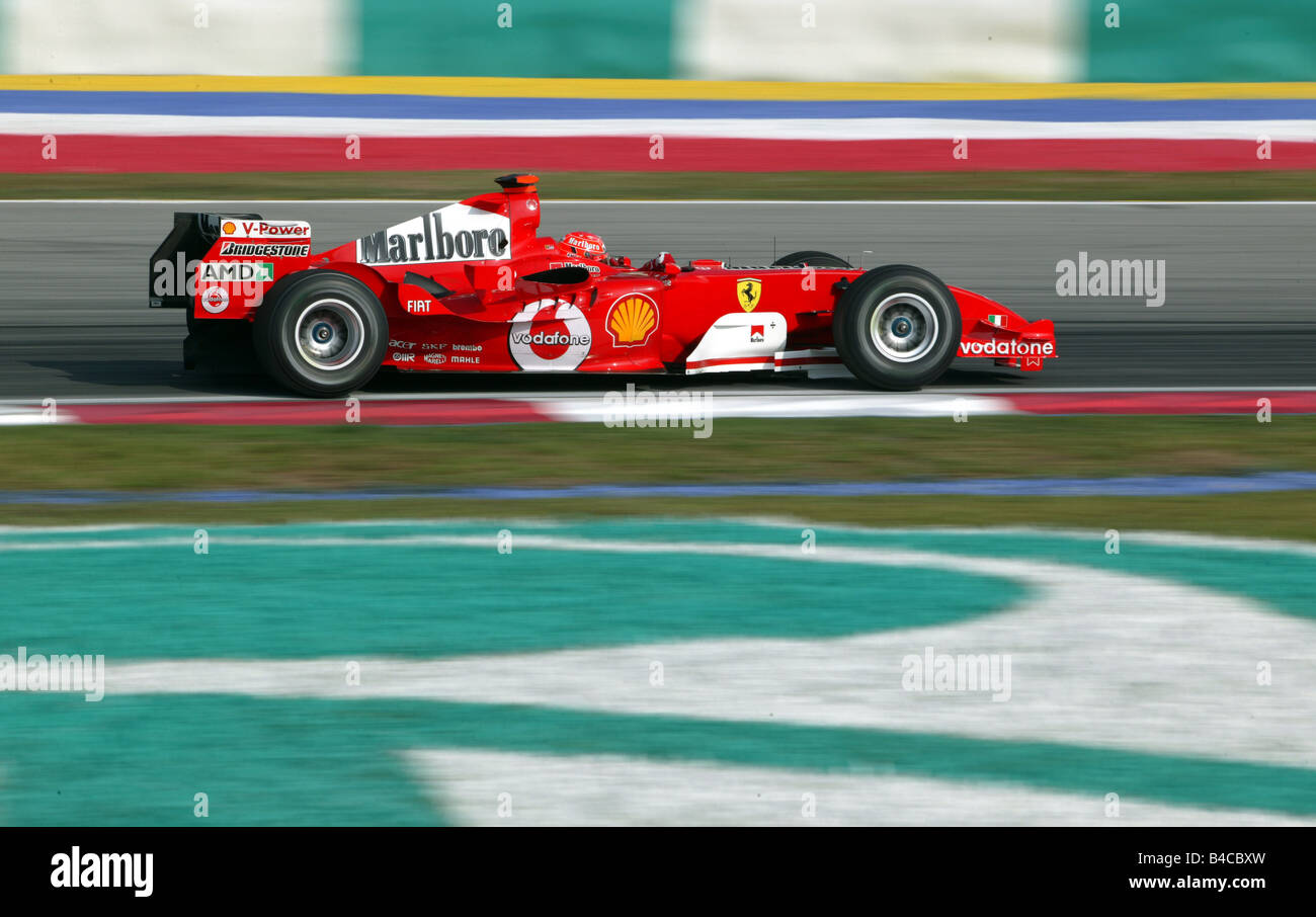 Sport moteur, Michael Schumacher en Ferrari, Formule 1 2005, hippodrome, circuit, course, voiture, vue latérale, Malaisie, photo Banque D'Images