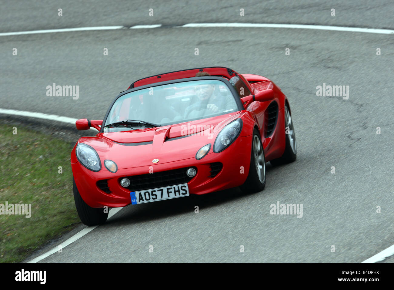 Lotus Elise SC, l'année de modèle 2008-, rouge, la conduite, la diagonale de l'avant, vue frontale, country road, open top Banque D'Images