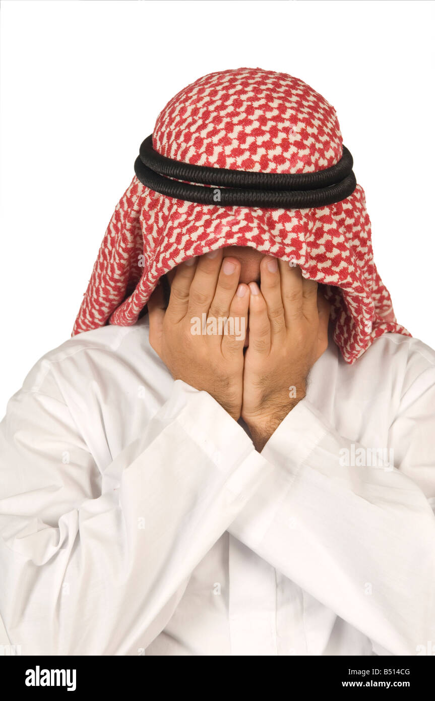 L'homme arabe head in hands Banque D'Images