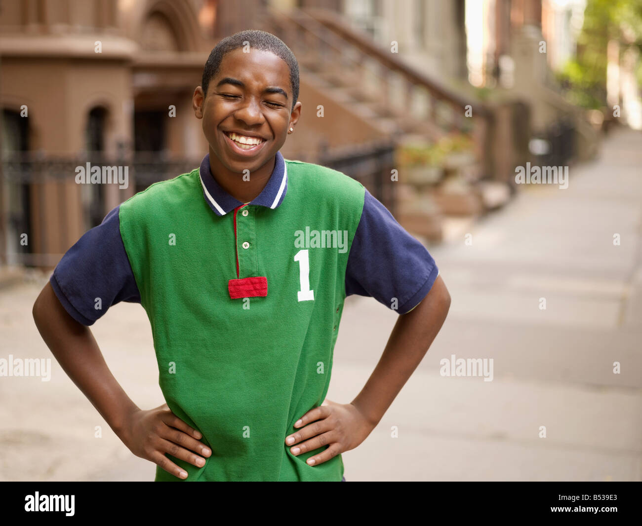 African teenage boy laughing in urban setting Photo Stock - Alamy