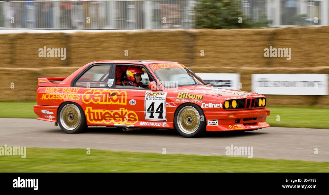 1988 BMW M3 concurrent BTCC avec chauffeur Alan Minshaw à Goodwood Festival of Speed, Sussex, UK. Banque D'Images