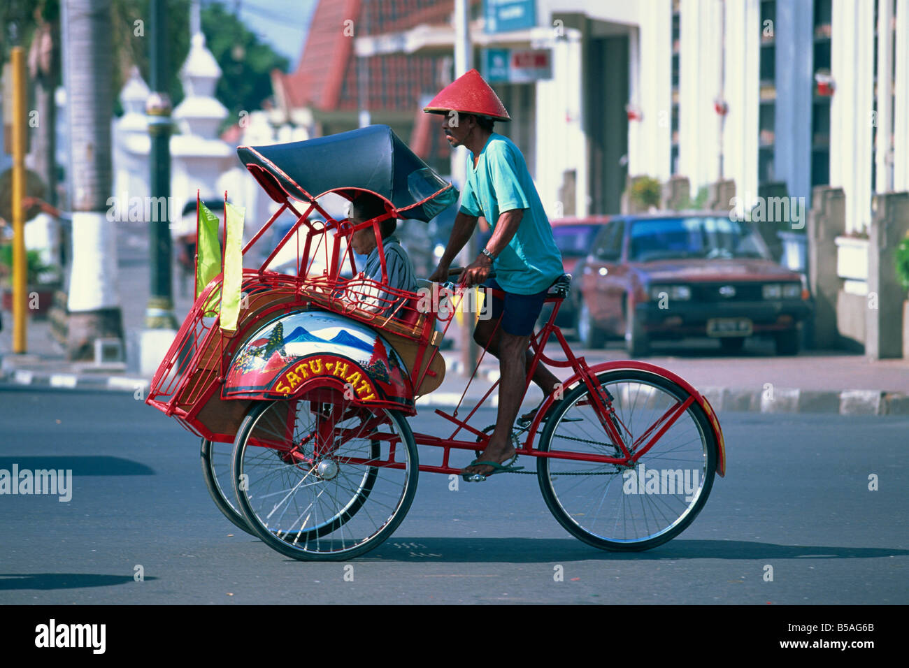 Un cycle rickshaw becak à Yogyakarta, Java, Indonésie, Asie du sud-est Banque D'Images