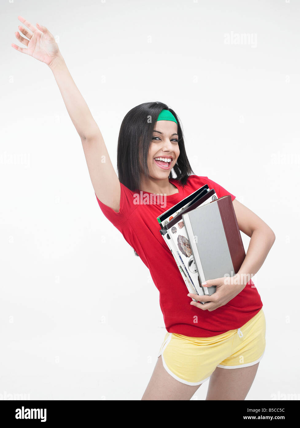 Une fille asiatique avec smart books Banque D'Images
