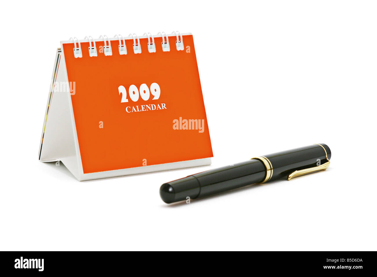 Calendrier de bureau Mini stylo et isolé sur fond blanc Banque D'Images