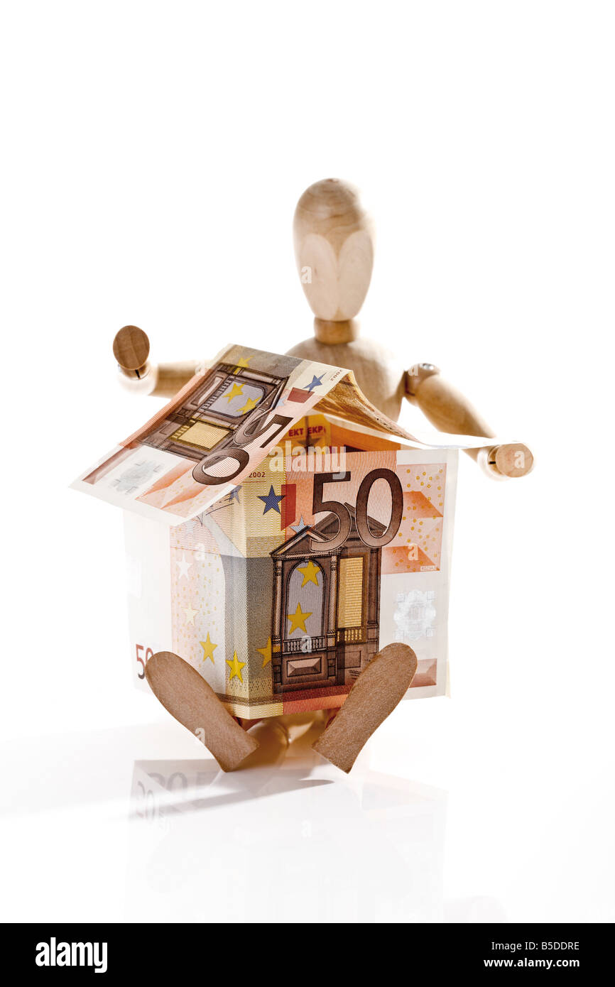 Mannequin holding maison faite à partir de l'Euro Banque D'Images