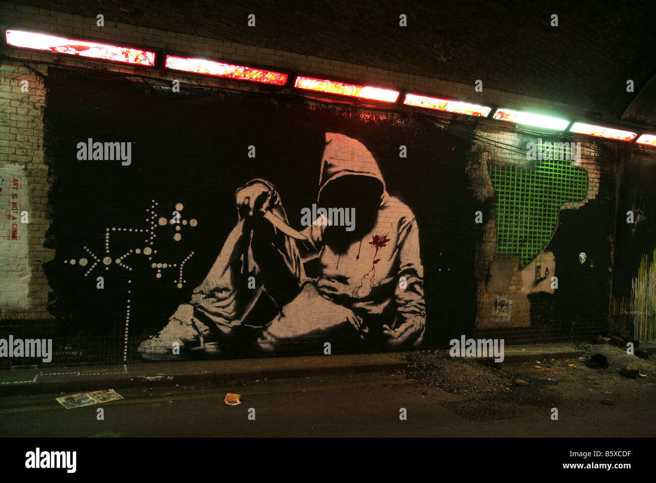 Sweat à capuche du crime du couteau, l'artiste graffiti Banksy art Banque D'Images