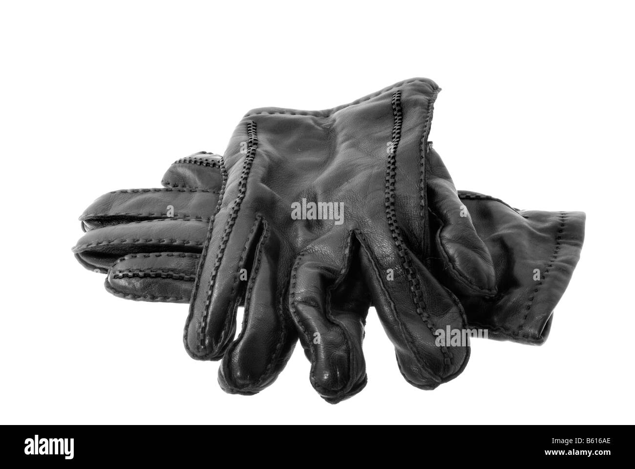 Gants en cuir noir isolé sur fond blanc Banque D'Images