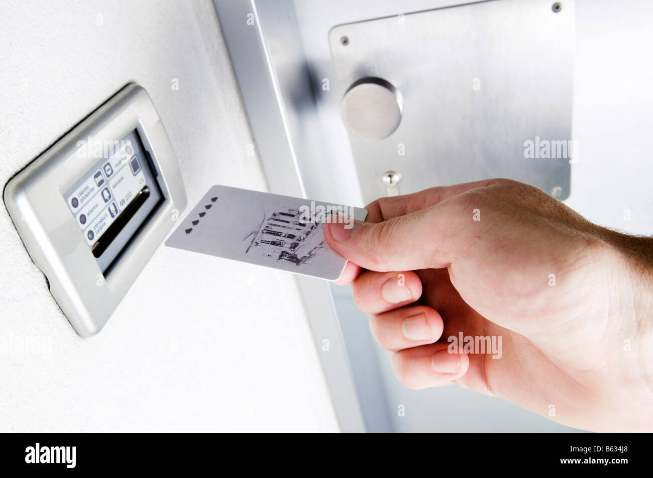 Close-up of a person's hand inserting cardkey Banque D'Images