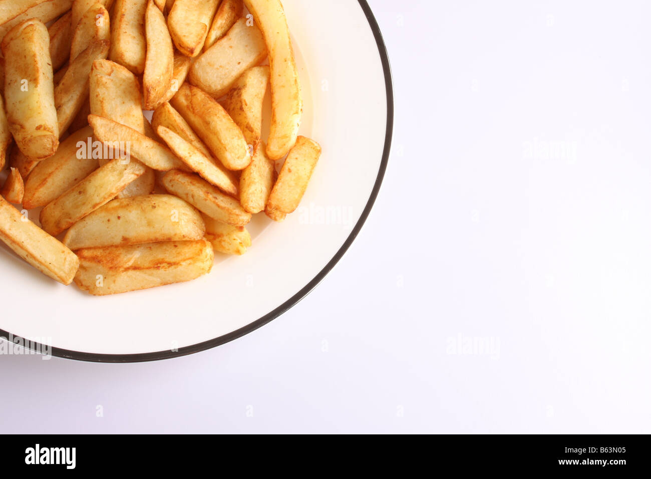 Une assiette de frites chunky Banque D'Images