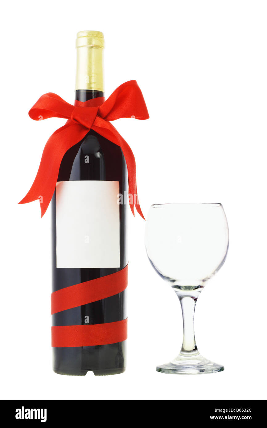 Bouteille de vin décoré de ruban arc rouge et blanc sur verre Banque D'Images