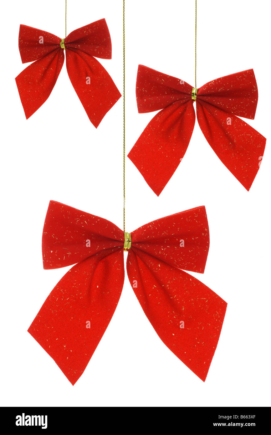 Ornements de Noël ruban arc rouge sur blanc Banque D'Images