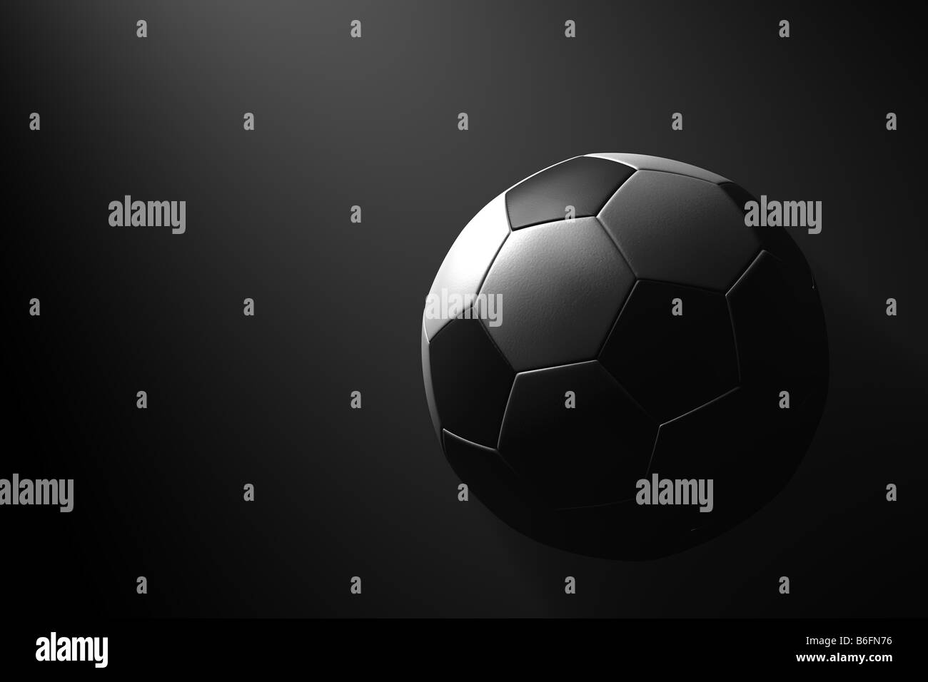Ballon de soccer sur fond noir Banque D'Images