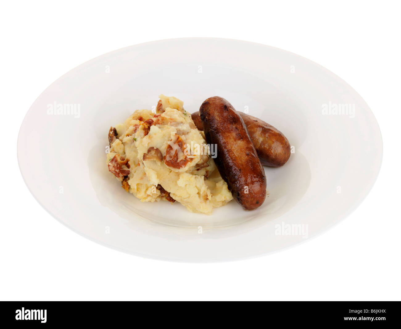 Style Italien saucisse de porc et purée de pommes de terre à l'assaisonnement d'Herbes isolés contre un fond blanc avec aucun peuple et un chemin de détourage Banque D'Images