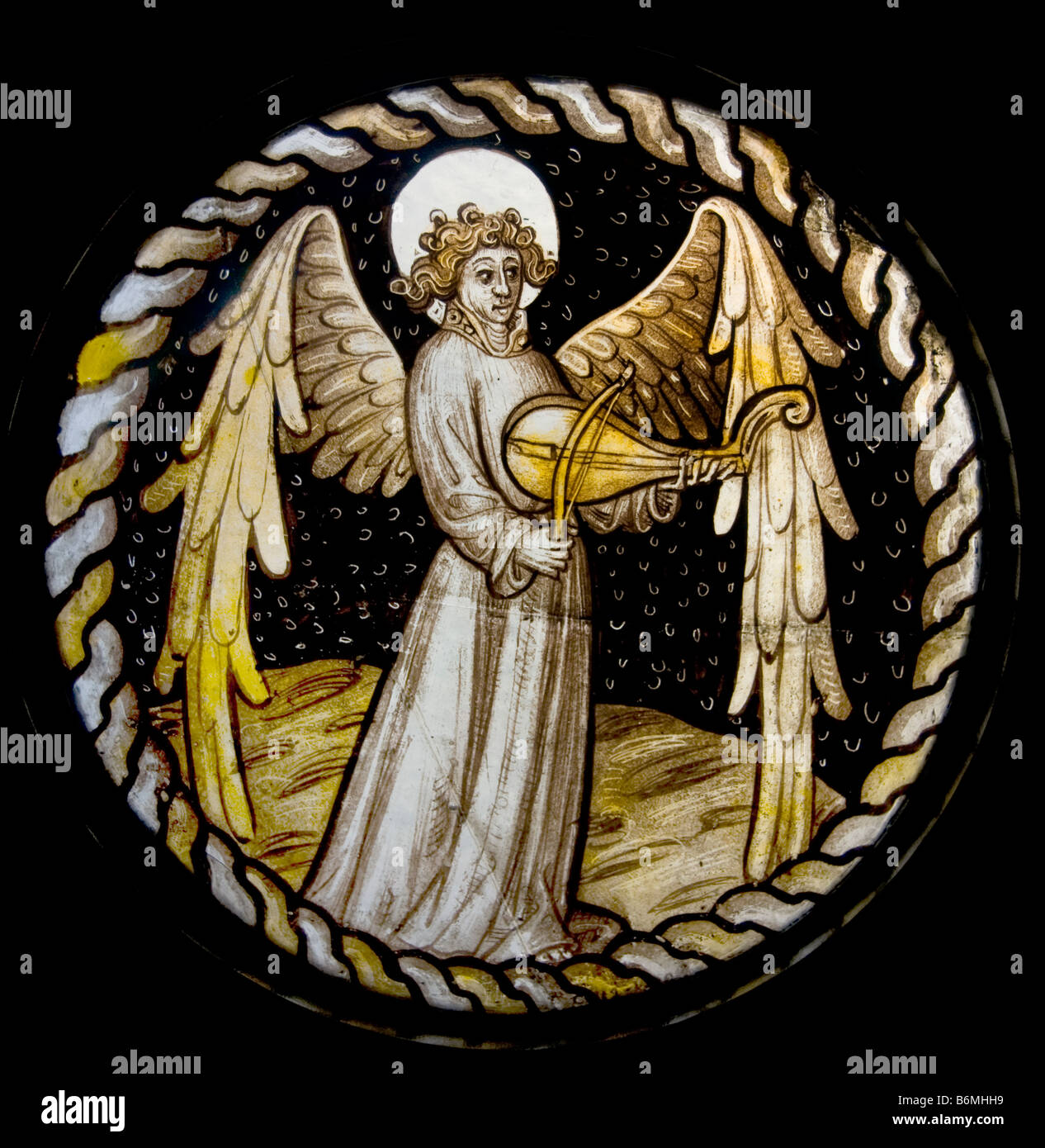 Angel la lecture d'un Rebeclders treillis légers au plomb vitrail London England Banque D'Images