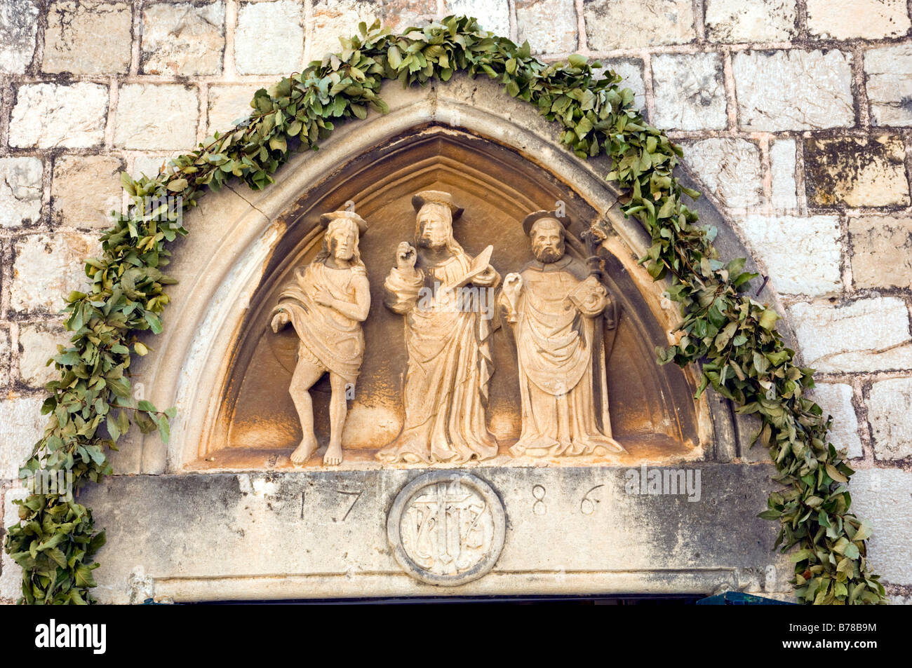 Icônes religieuses dans les murs de la vieille ville de Dubrovnik Croatie Banque D'Images