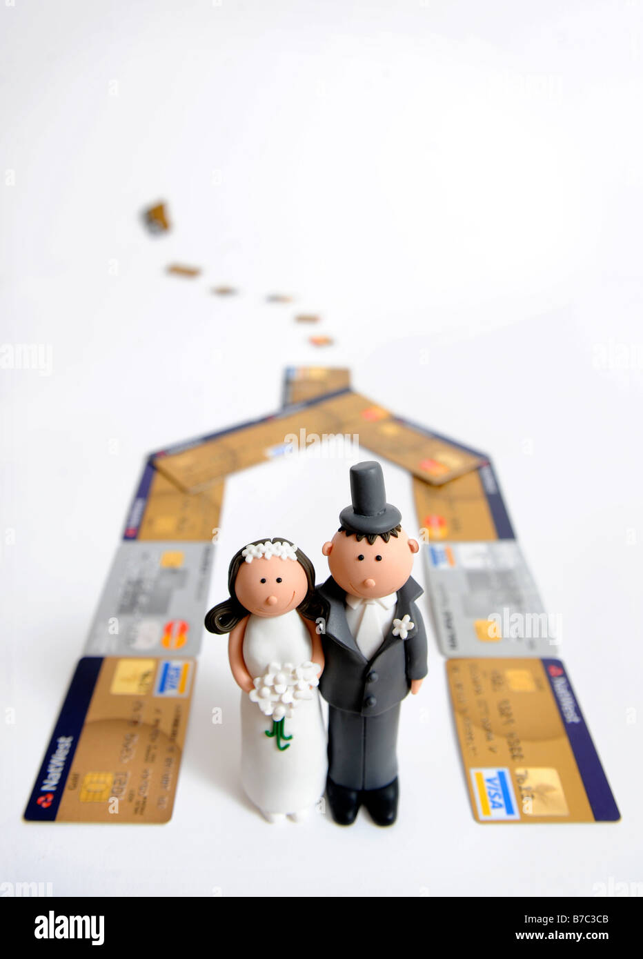 COMIC MARIÉS CHIFFRES POUR Décorer un gâteau de mariage en photo COMME SI LA VIE DANS UNE MAISON CARTE DE CRÉDIT Banque D'Images