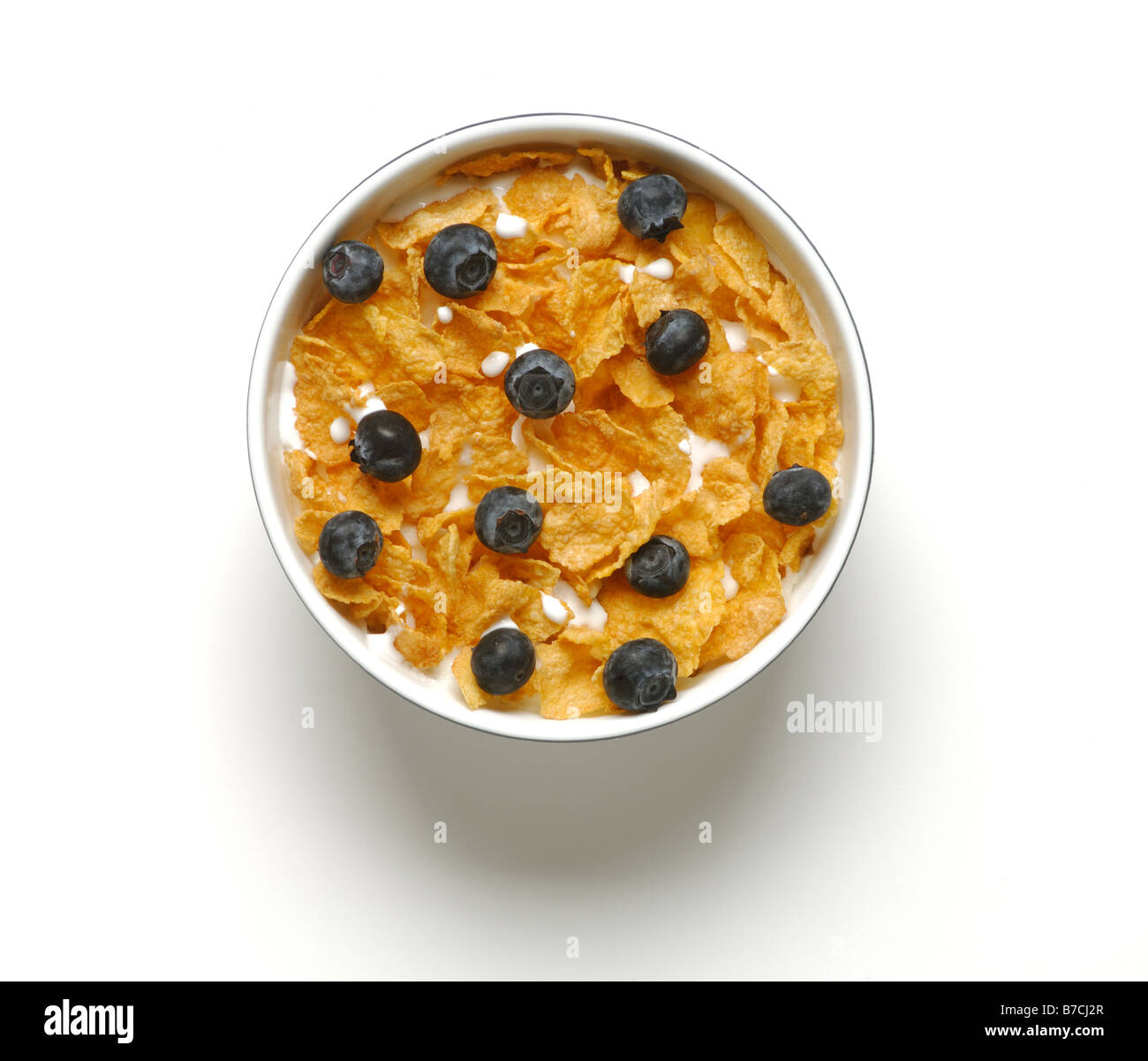 Petit-déjeuner un bol de céréales avec du lait et de bleuets. Banque D'Images Petit-déjeuner un bol de céréales avec du lait et de bleuets. Banque D'Images