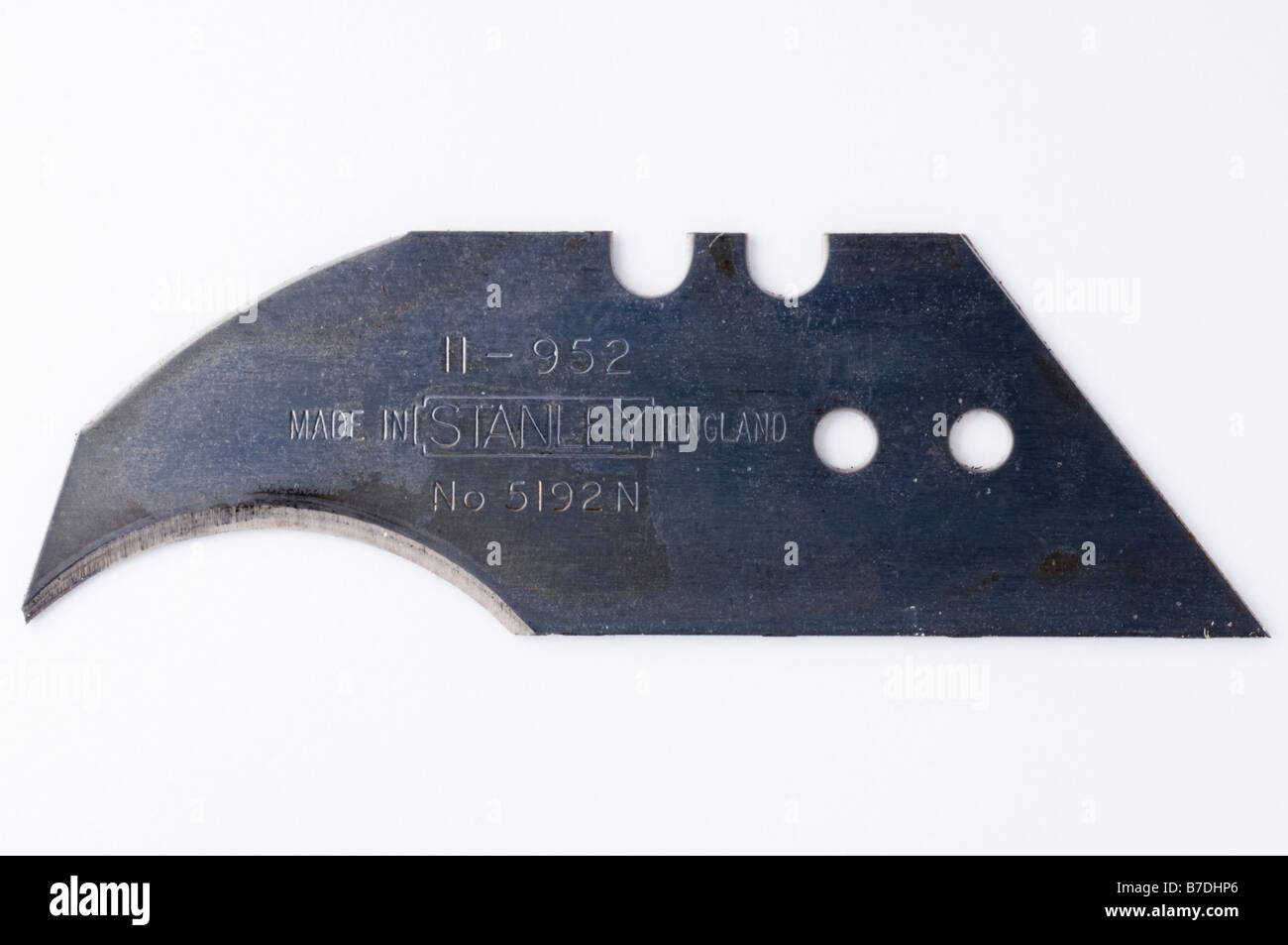 Un gros plan d'une lame de couteau Stanley tourné sur un fond blanc Banque D'Images