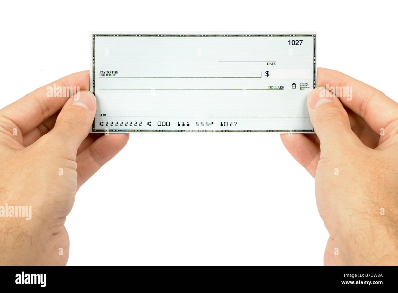 Un chèque en blanc dans une main de l'homme Banque D'Images