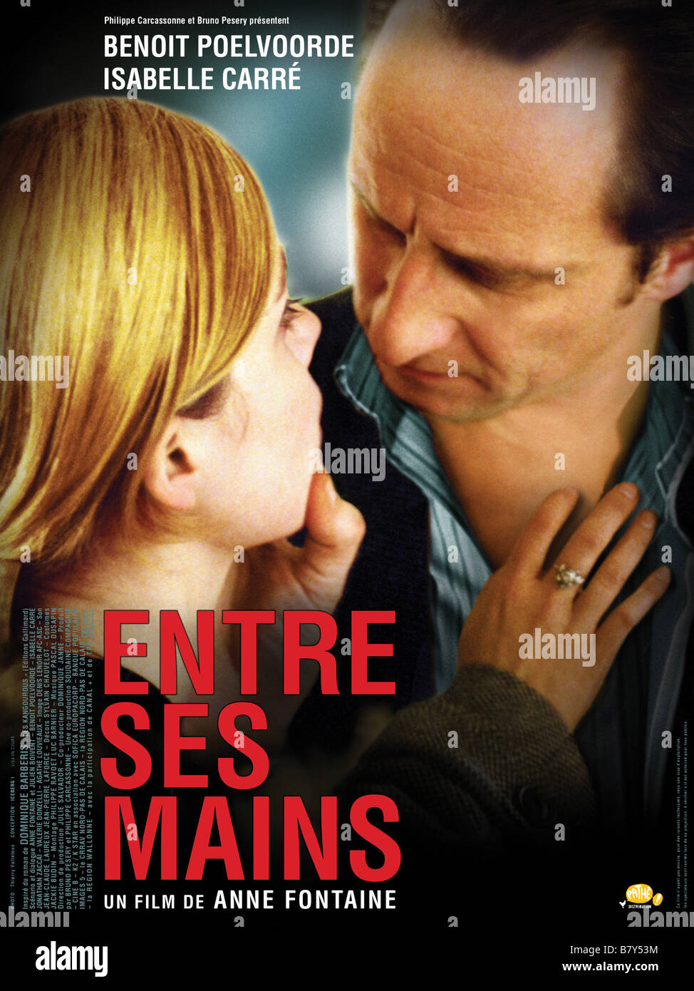 Entre ses mains entre ses mains Année : 2005 - France Affiche / poster Benoît Poelvoorde, Isabelle Carré Réalisateur : Anne Fontaine Banque D'Images
