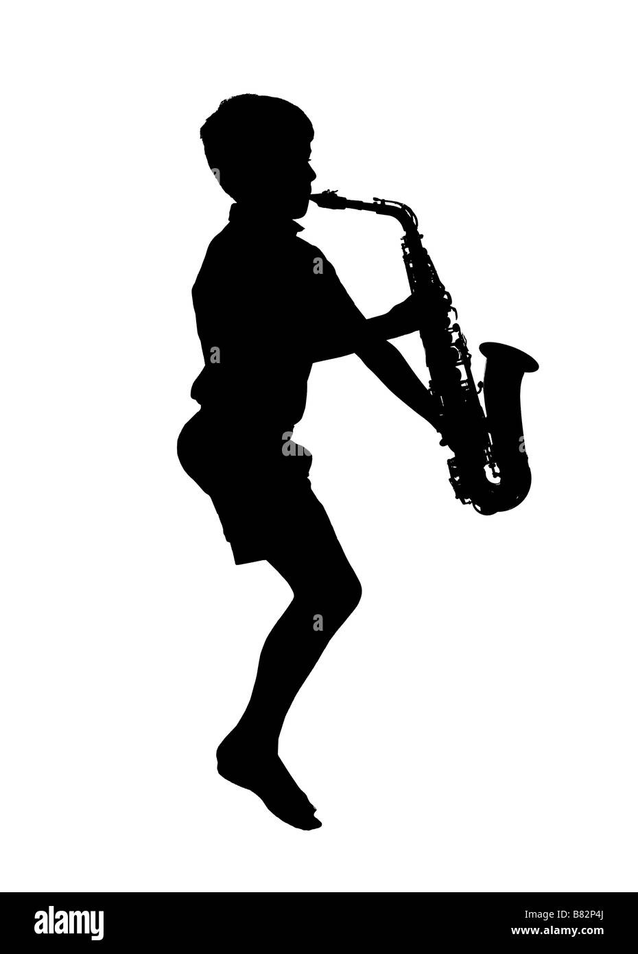 Silhouette de garçon à jouer du saxophone Banque D'Images