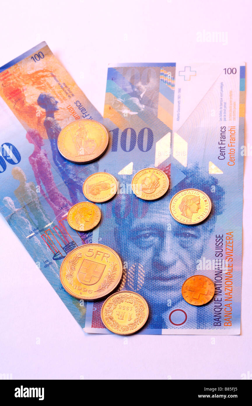 Pièces de monnaie franc et NT 1000 dollar bill Banque D'Images Pièces de monnaie franc et NT 1000 dollar bill Banque D'Images