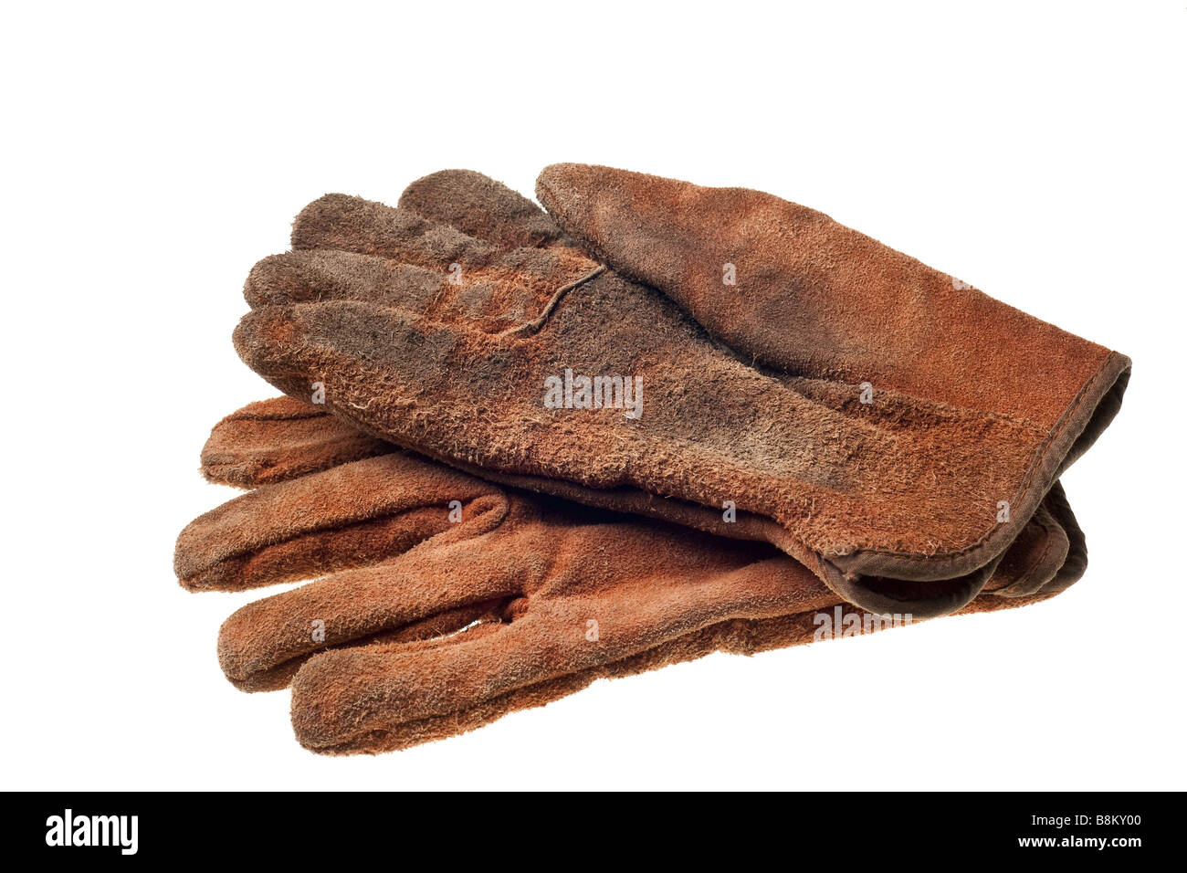 Vieux grungy gants de travail isolé sur fond blanc Banque D'Images