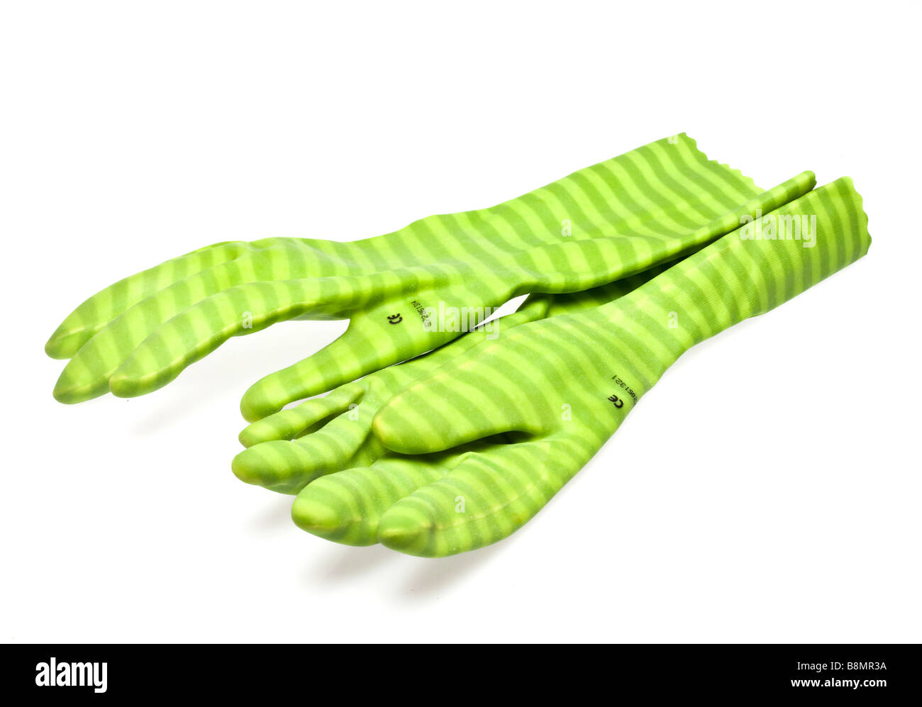 Paire de gants en caoutchouc stripey vert sur blanc dentelle Banque D'Images