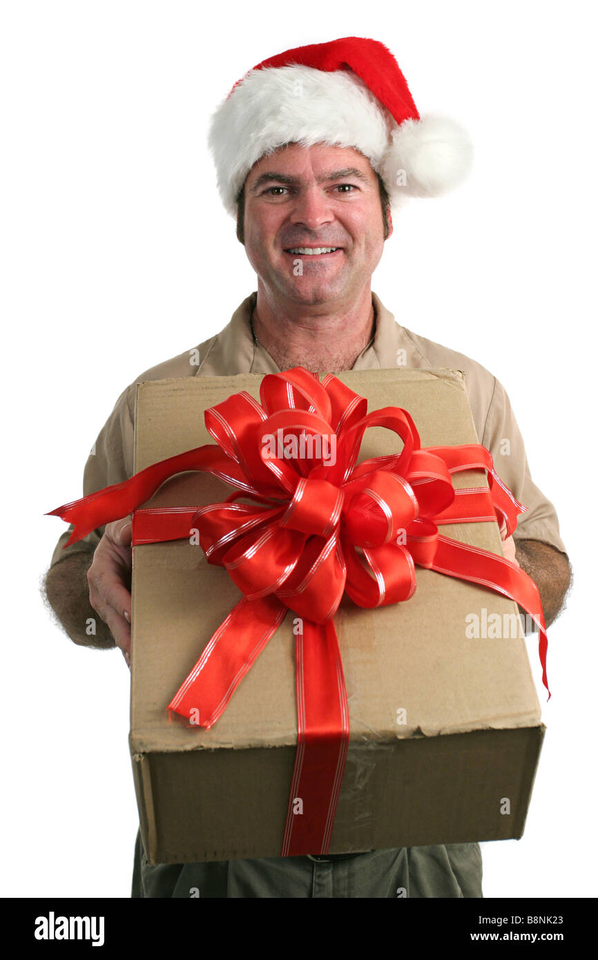 La prestation d'un homme dans un chapeau de Père Noël Offrir un cadeau avec un arc isolé Banque D'Images