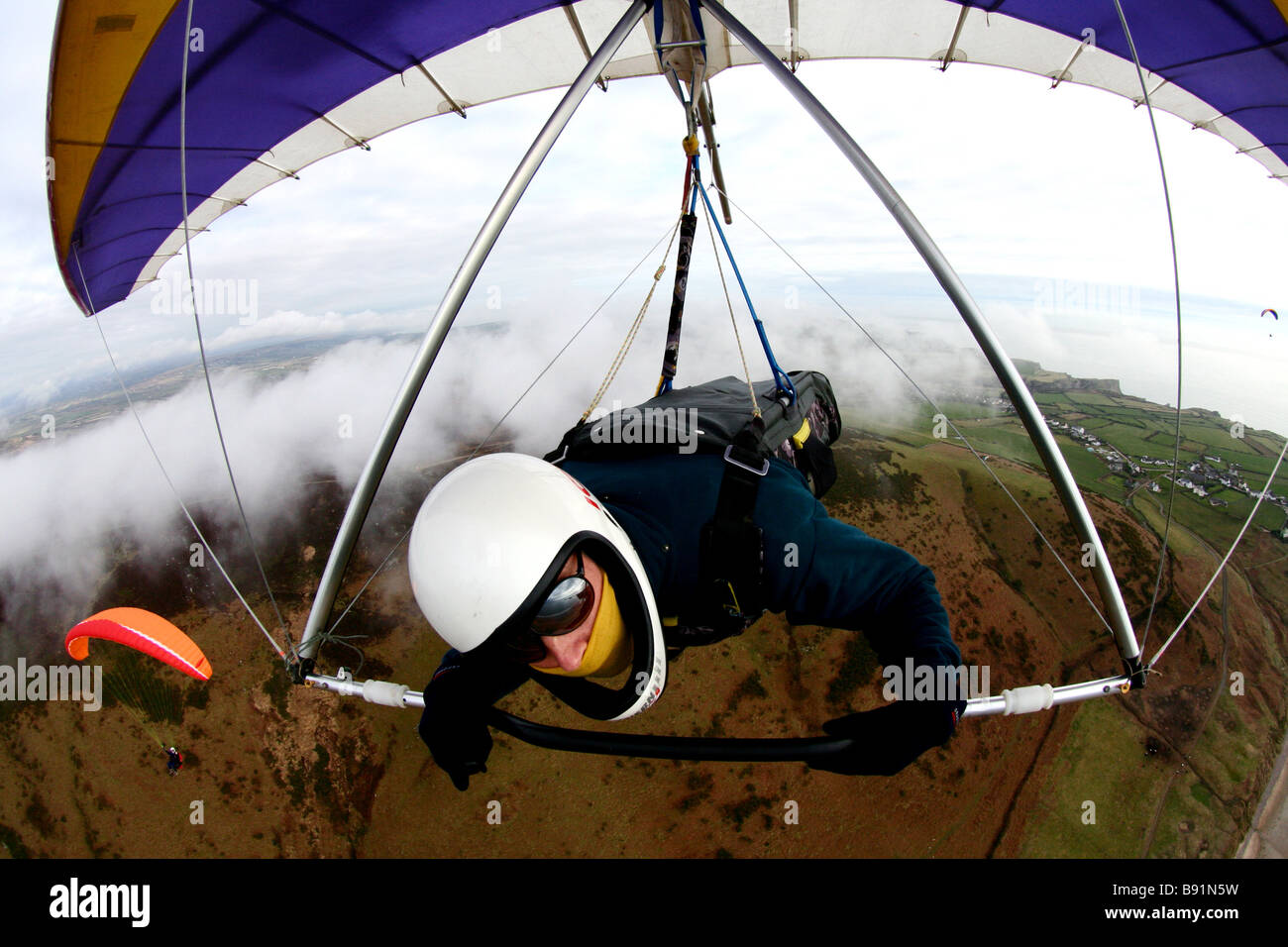 Vol en deltaplane shot Rhossili Wales UK Banque D'Images