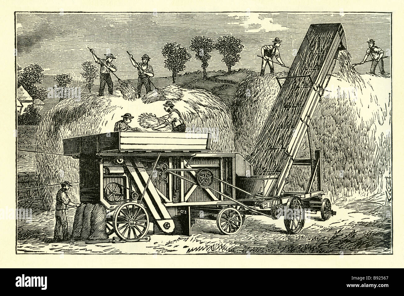 Threshing machine portable utilisé à la ferme à l'époque victorienne Banque D'Images