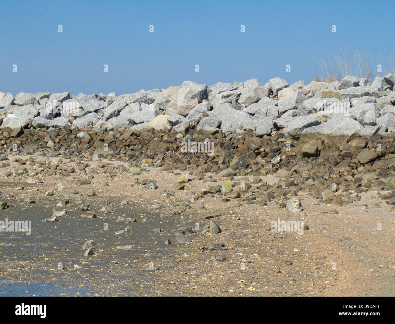 Marée basse rock jetty Banque D'Images