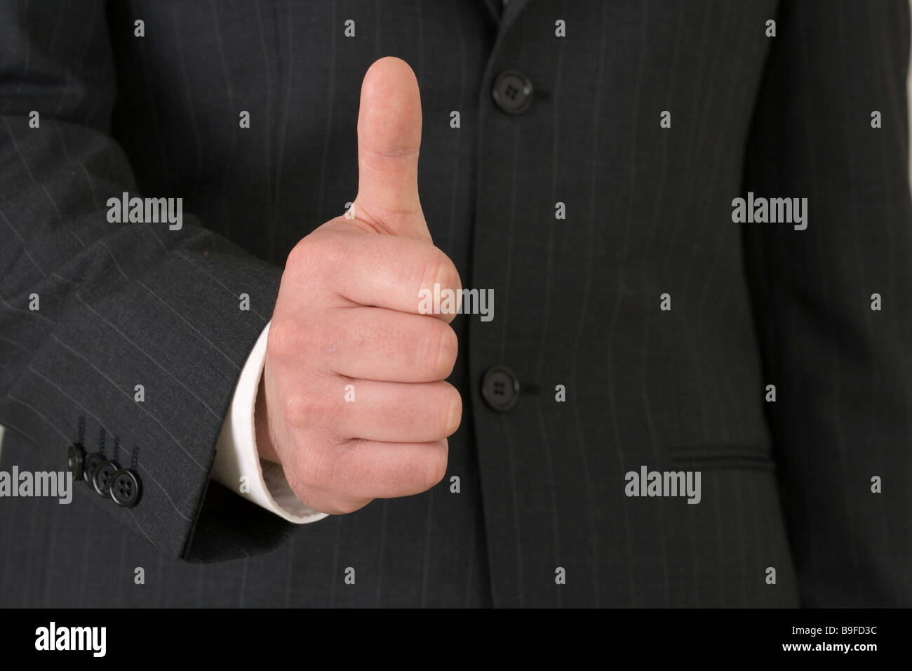 Businessman holding thumb up Banque D'Images