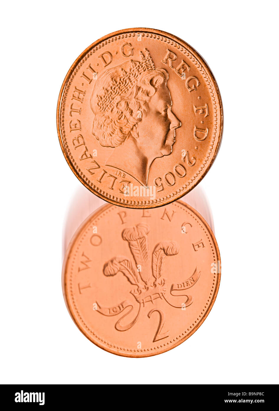 Deux pence coins des deux côtés avec le dessous du mouvement montrant l'abandon Banque D'Images