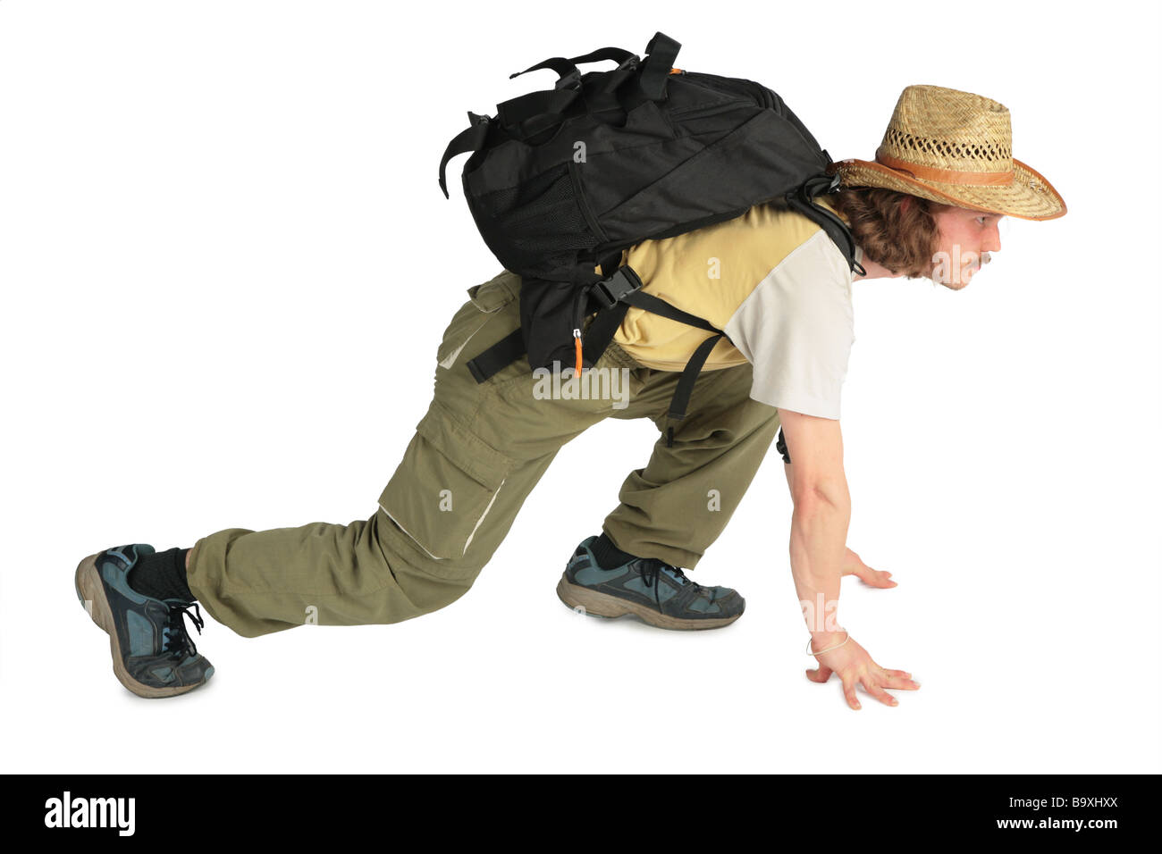 Voyageur avec sac à dos en chapeau de paille à 4 pattes Banque D'Images