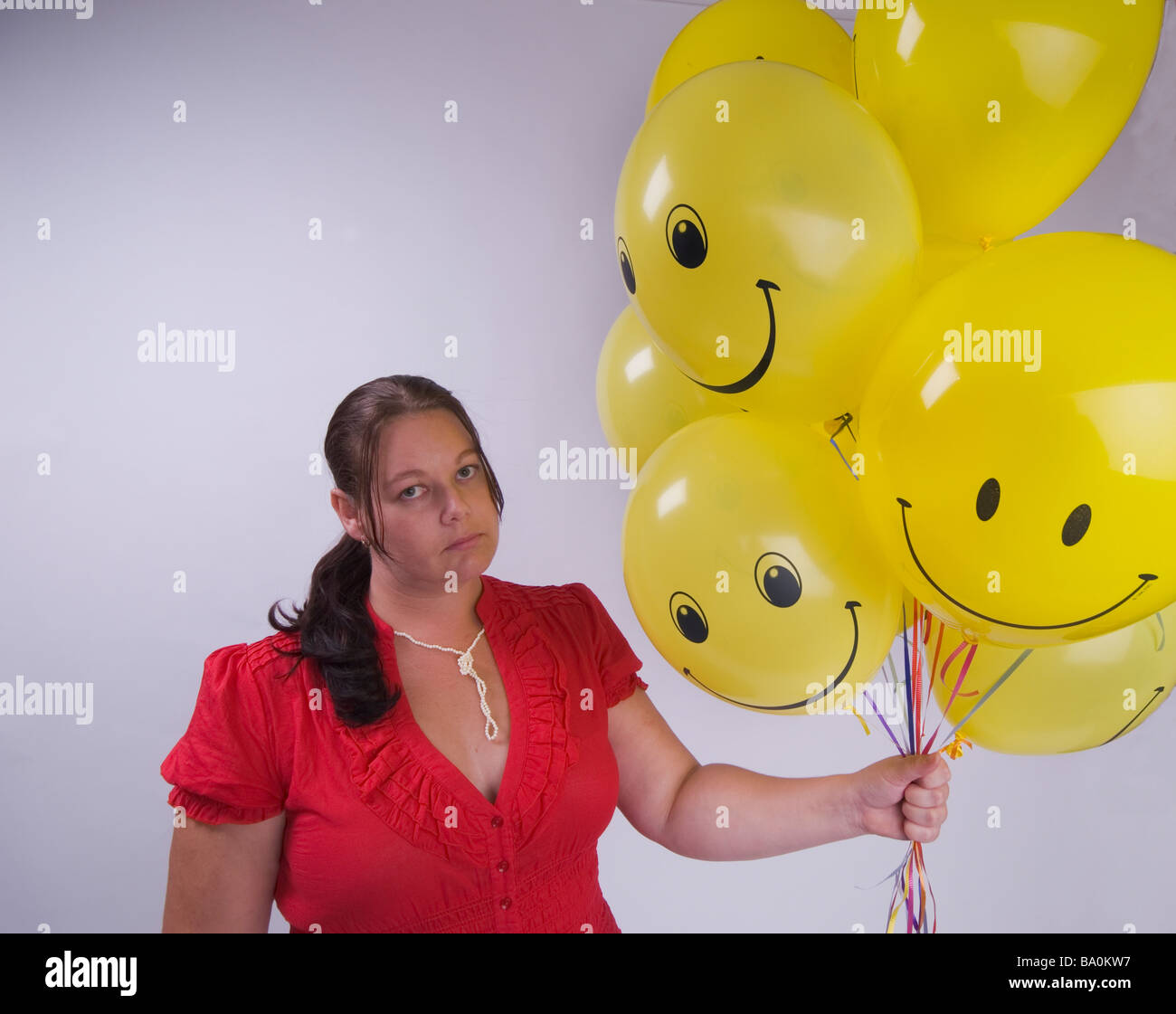 Sad woman with balloons Banque D'Images