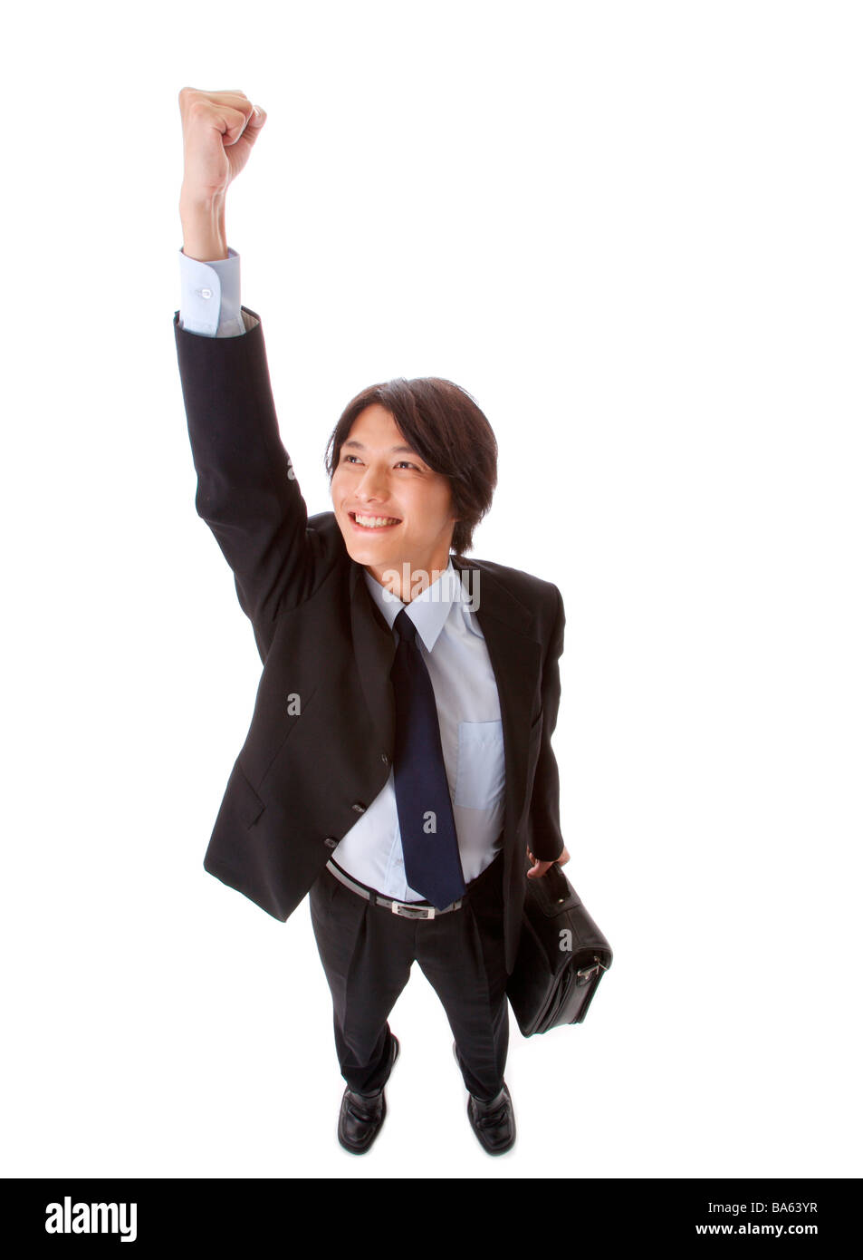 Businessman standing with fist up smiling high angle view Banque D'Images