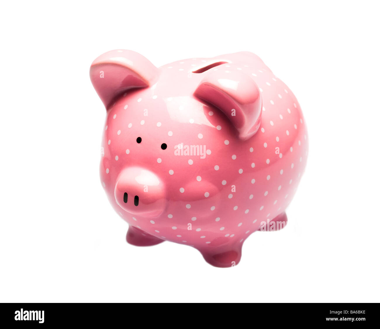 Pink piggy bank avec des taches blanches sur fond blanc Banque D'Images