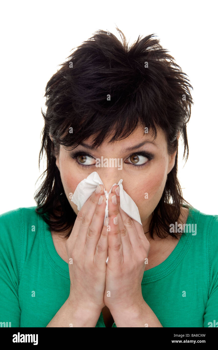 Woman blowing son nez Banque D'Images Woman blowing son nez Banque D'Images