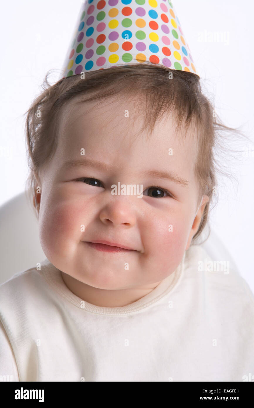 Enfant d'un an avec un parti-hat Banque D'Images Enfant d'un an avec un parti-hat Banque D'Images