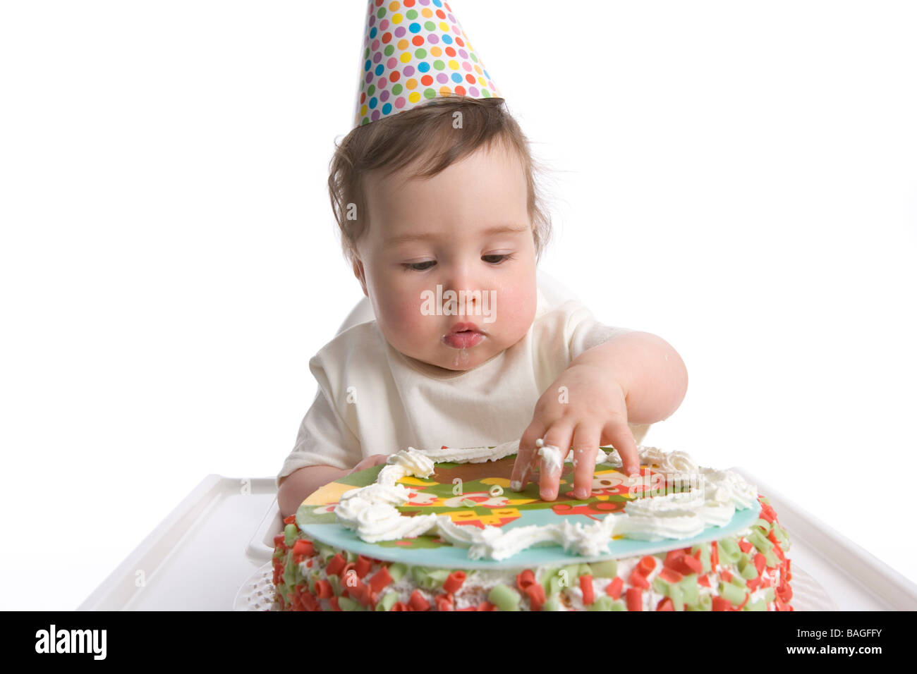Premier anniversaire avec chapeau de parti et de petits gâteaux d'anniversaire Banque D'Images