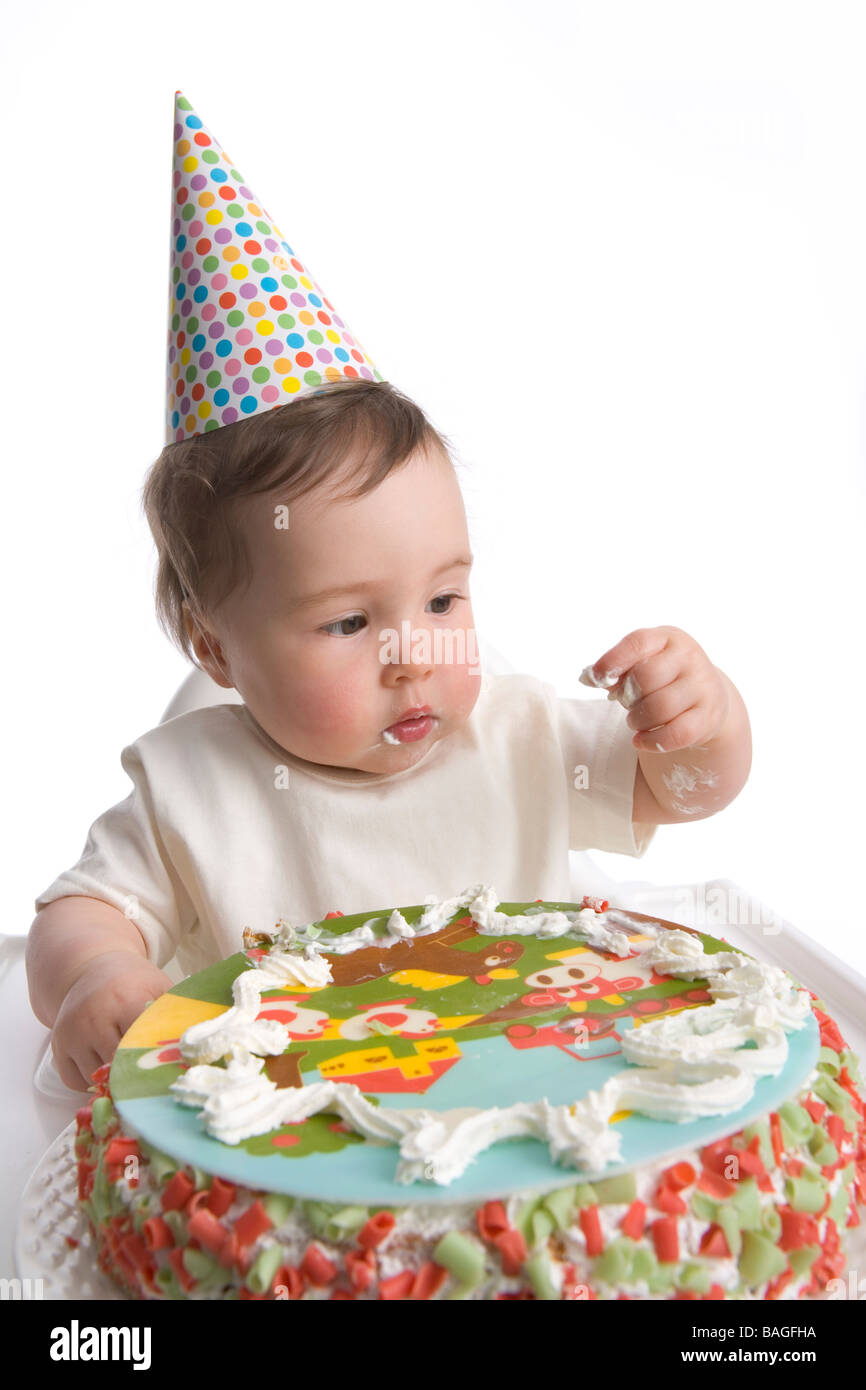 Premier anniversaire avec chapeau de parti et de petits gâteaux d'anniversaire Banque D'Images