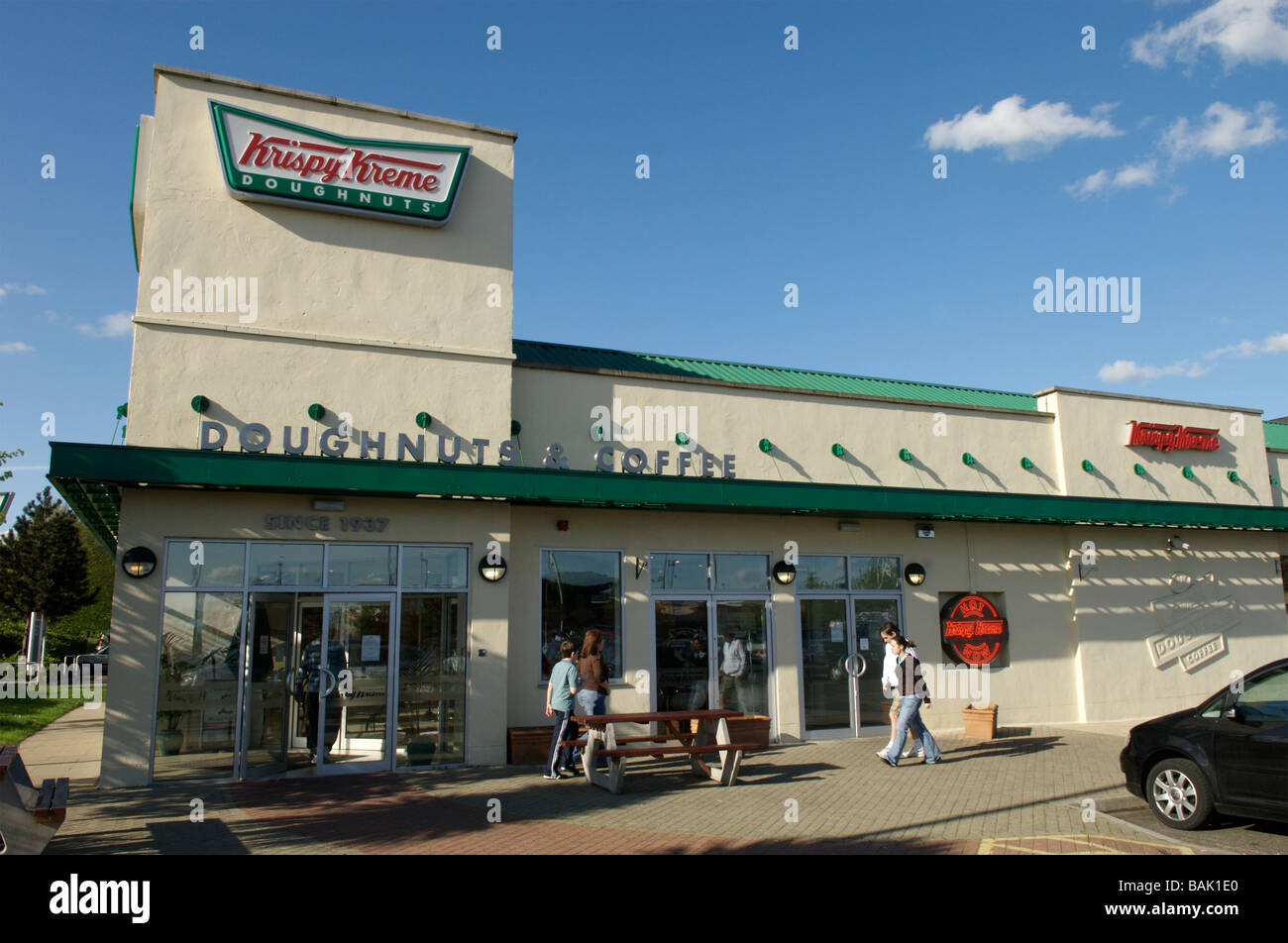 Un lecteur de beignes Krispy Kreme à emporter Banque D'Images