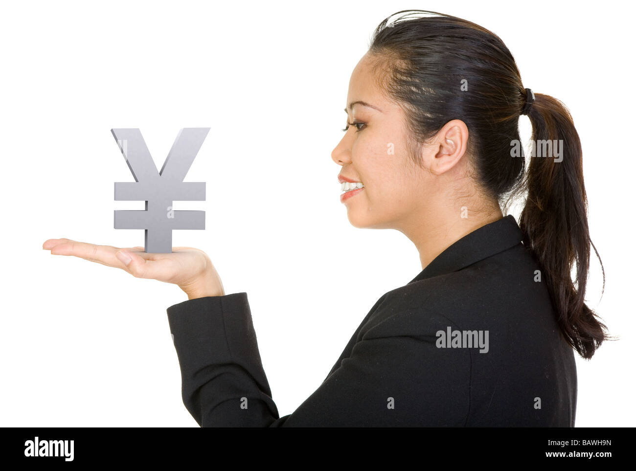 Asian business woman holding a yen Banque D'Images