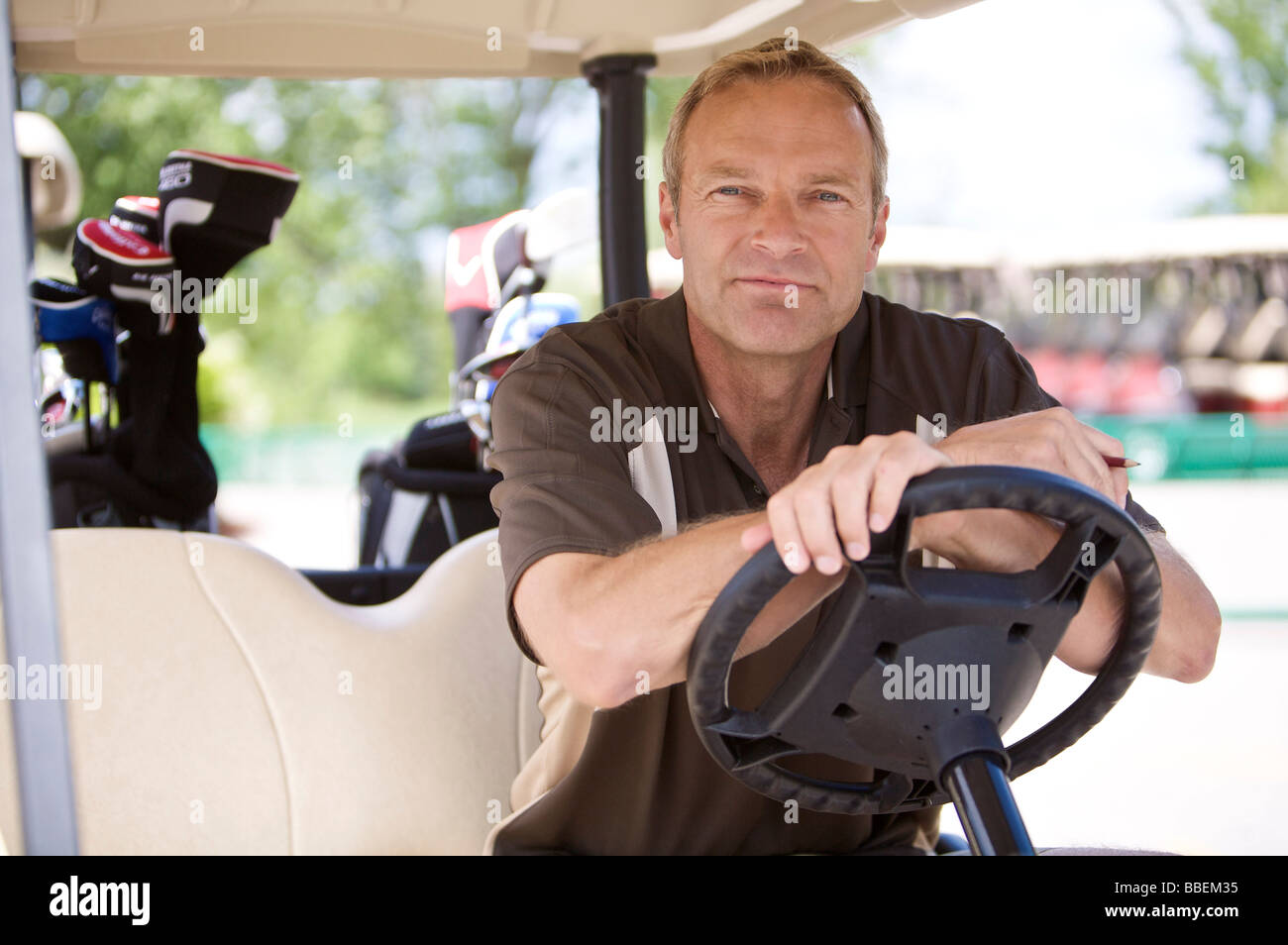 Portrait of Man in Golf Cart Banque D'Images