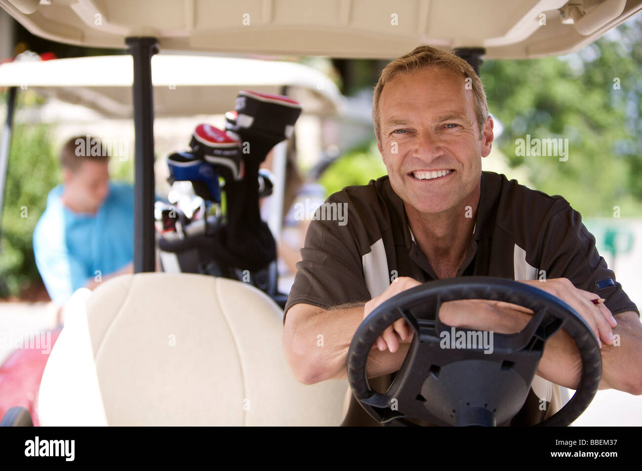 Portrait of Man in Golf Cart Banque D'Images